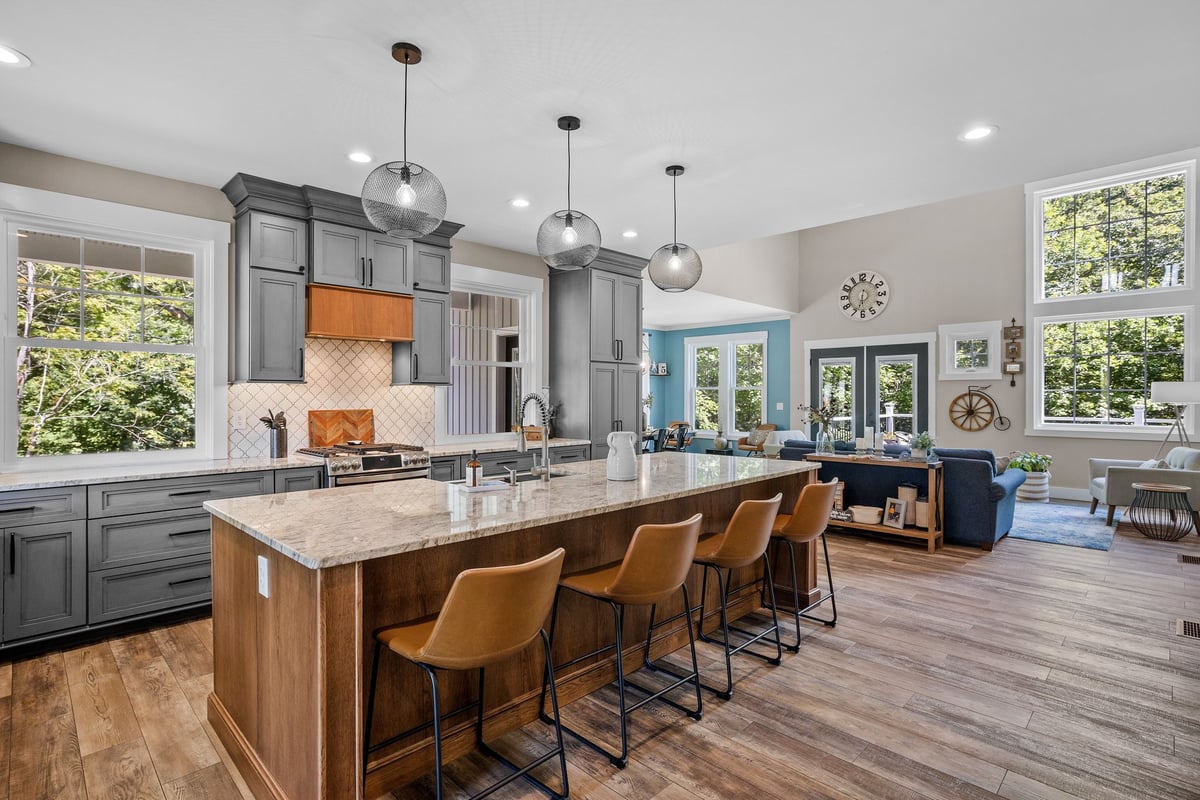 The interior design of a beautiful kitchen with a large island in a modern home