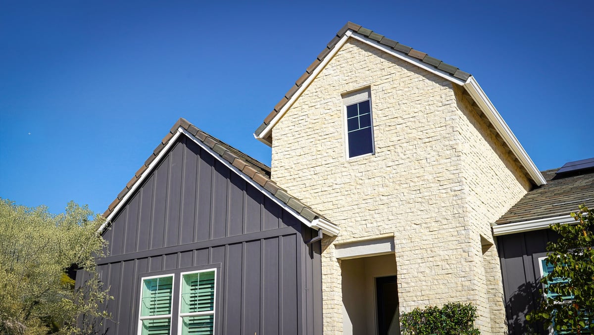 Highlighting the contrast between the siding of a house. Stone and wood siding