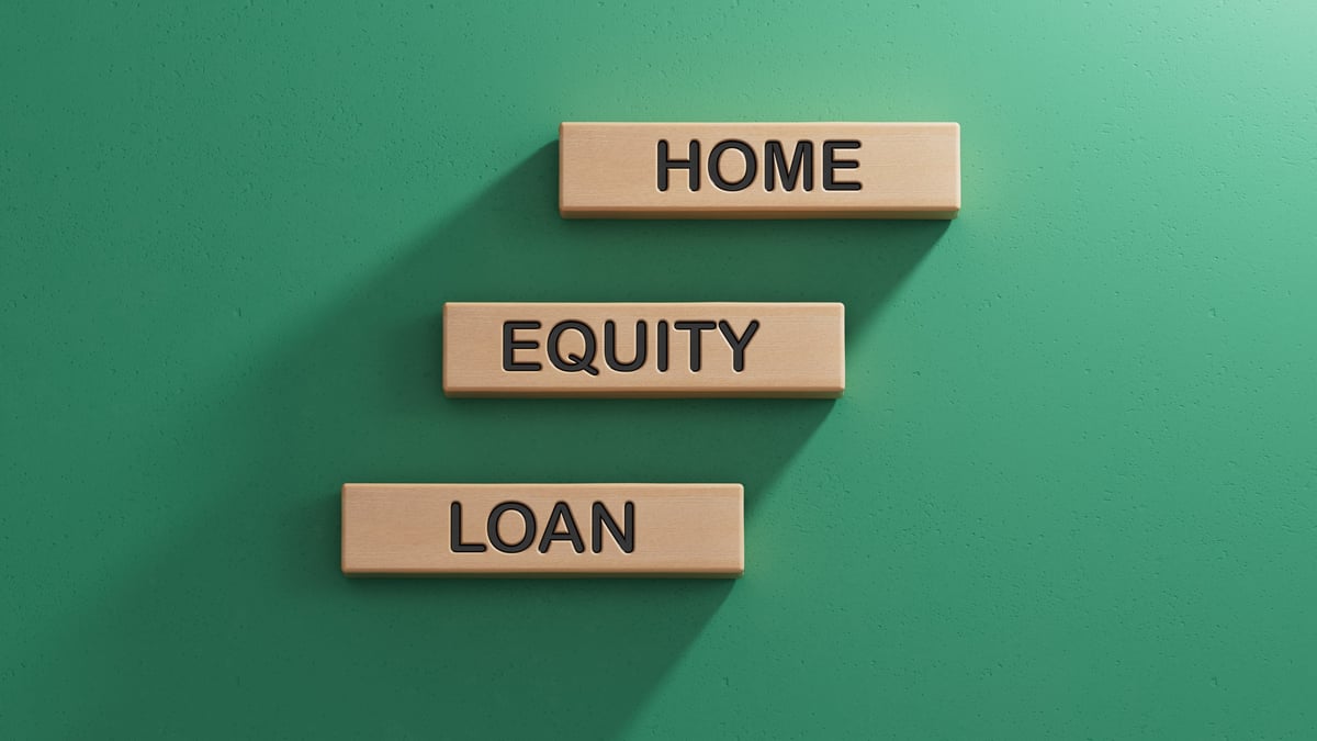 home Equity loan Word Written In Wooden Cube. Close up. Wooden cube blocks. Copy space.3D rendering on green background.