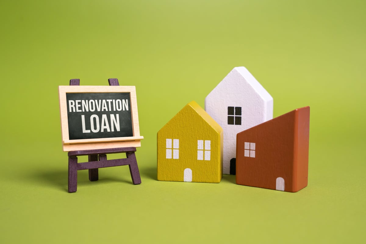 Renovation loan and house figures. Property improvement, budgeting, investment in real estate.