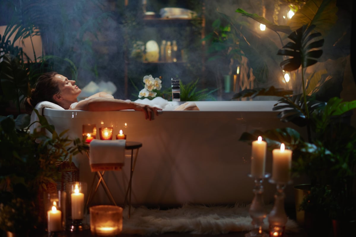 Bathroom Remodeling The Woodlands TX spa bathroom with freestanding tub candles and greenery for a relaxing spa-like setting