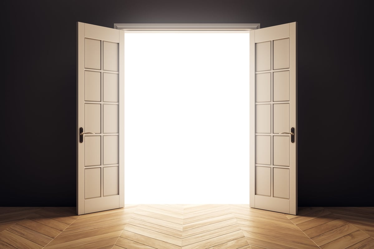 Open beige double doors with bright white light shining through in a dark room, wooden floor pattern, abstract background of opportunity and light, 3D Rendering