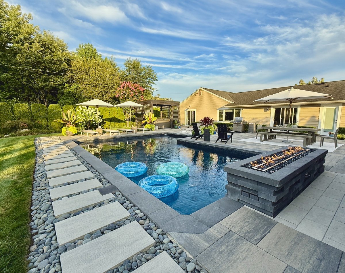 Beautiful landscaped backyard with native plants, patio and outdoor living design