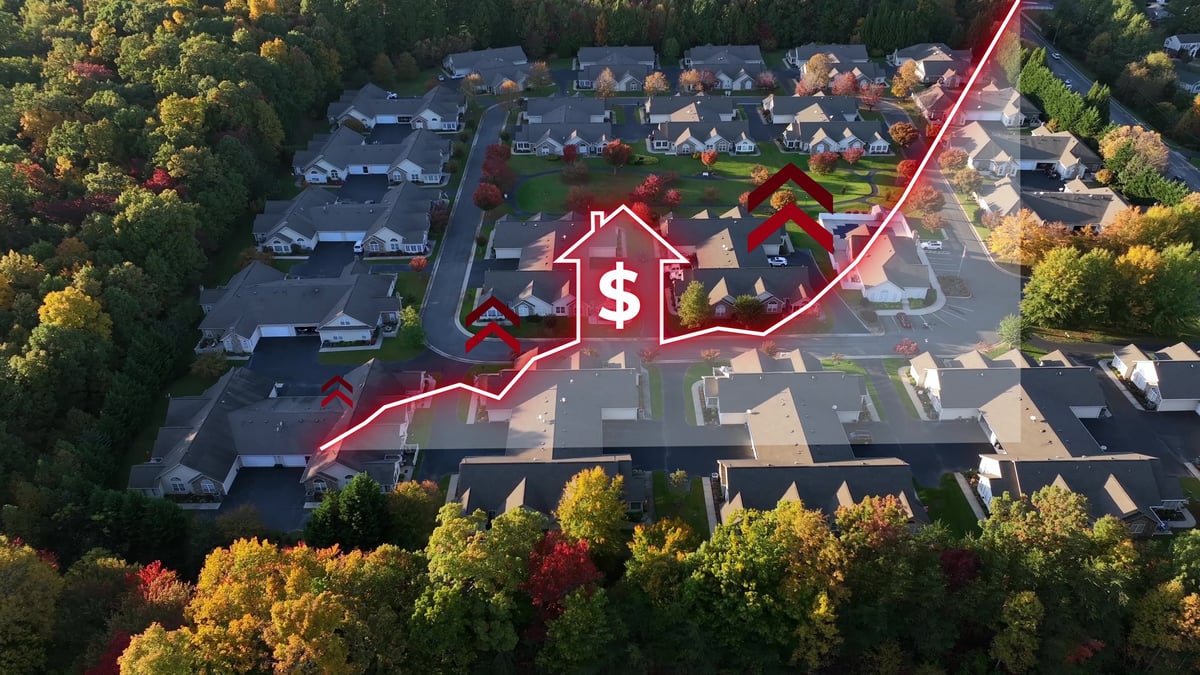 Increasing housing prices in America. Aerial view of modern neighborhood with red house, positive chart animation. Inflation, expensive houses, affordability theme