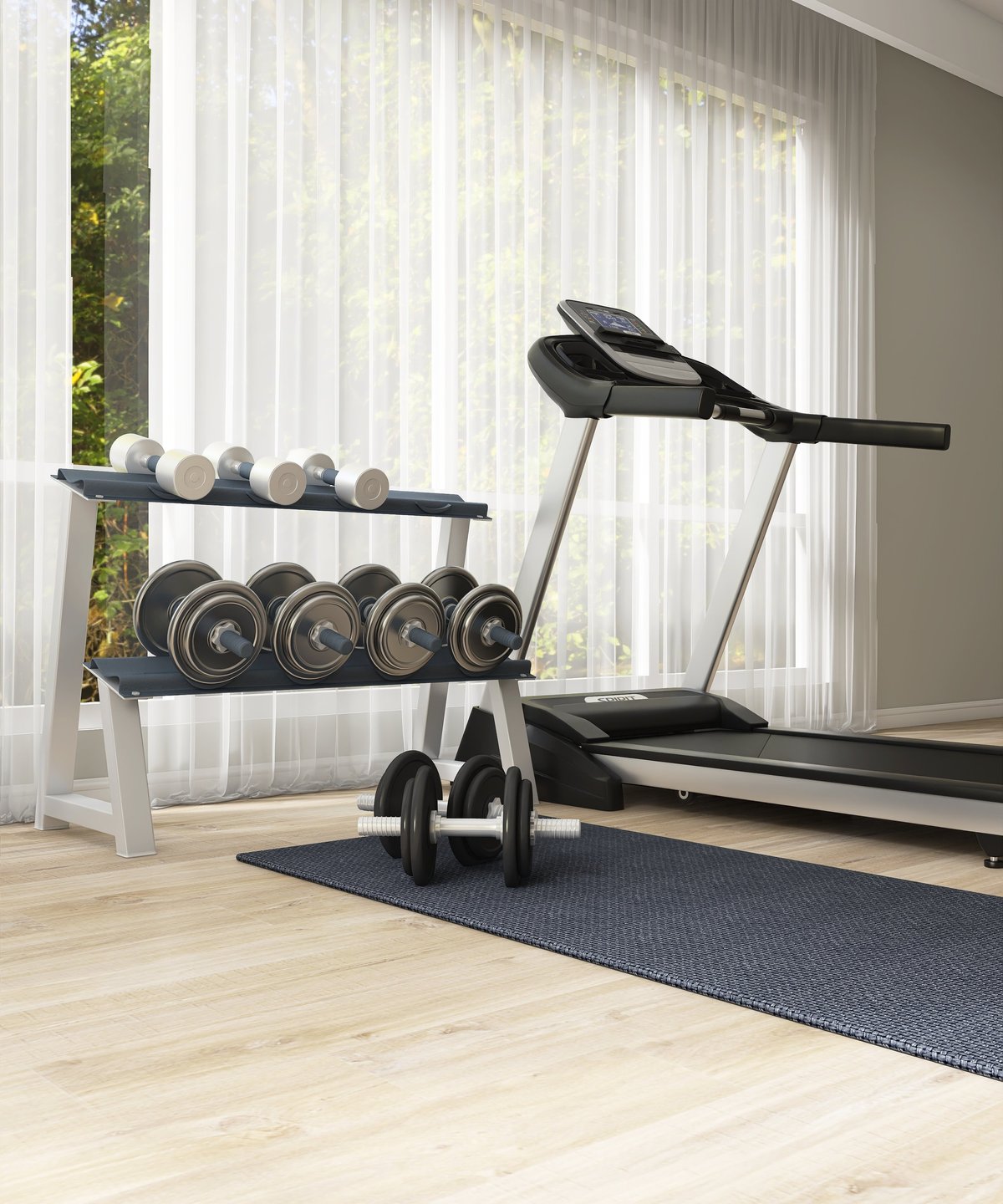 Luxury home gym with treadmill, shelf of dumbbells, black yoga mat on parquet floor by window with sunlight